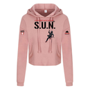 Stuntwomen United blush pink women’s cropped hoodie shown from the front, featuring S.U.N. text with rappelling stuntwoman in red heels and Stunt Team sleeve logo.