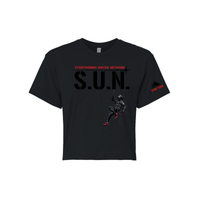 Stuntwomen United black women’s cropped T-shirt shown from the front, featuring S.U.N. logo with rappelling stuntwoman graphic in red heels and Stunt Team sleeve logo.