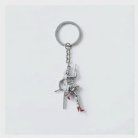 Video showing the Stuntwomen United metal keychain with a stuntwoman rappelling figure in red heels.
